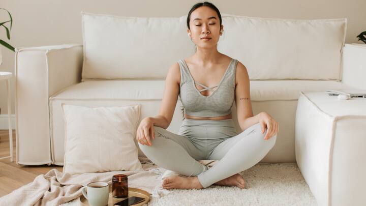 Forget About Being Cross-Legged: The common perception is you must be sitting cross-legged for meditation. Should that position feel uncomfortable, pick one that feels good for your body, sitting on a chair, dropping on a sofa, or even lying down. Always remember that comfort means staying present. (Image Source: Canva)
