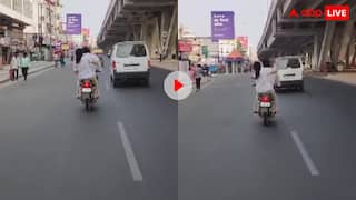 खौफ में है पूरा मर्द समाज! बाइक चला रहे पति को पीछे बैठकर चप्पलों से पीटती रही महिला, वीडियो वायरल