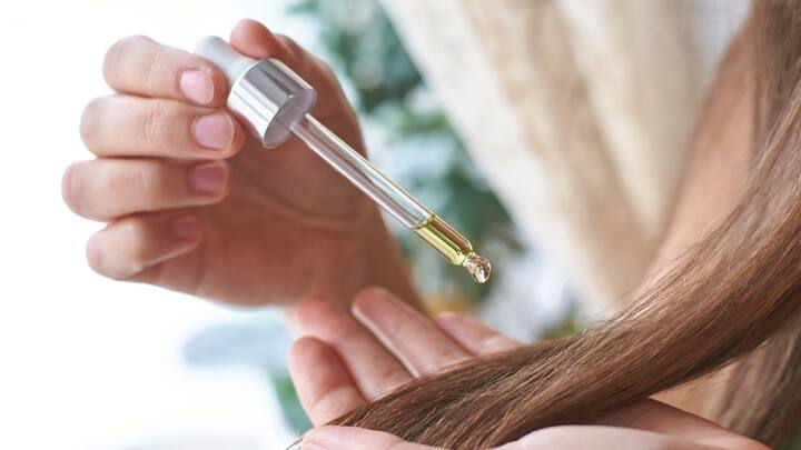 1. Hair Oils: Hair oils nourishes the scalp as well as the strands. They help in locking in the moisture and reducing dryness. This tames the frizz and strengthens hair roots which minimises hair fall. Oiling your hair frequently supports healthier and thicker hair with less hair fall and a natural shine. (Image Source: Canva)