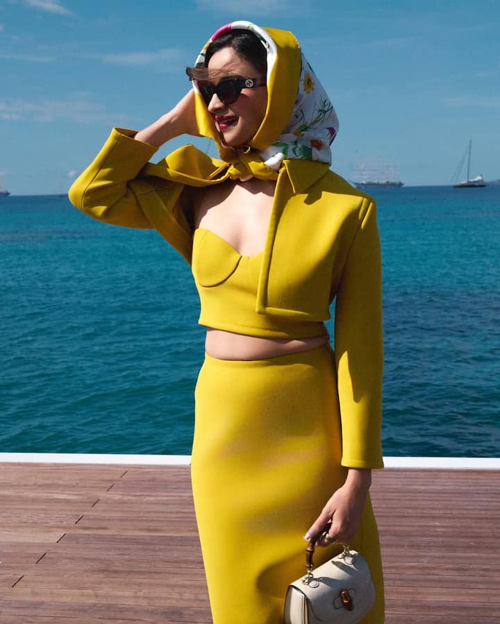 This time, the Gangubai Kathiawadi star wowed in a vibrant yellow Gucci co-ord set featuring a sleek pencil skirt, a matching cropped bustier top, and a sharply tailored cropped jacket.
