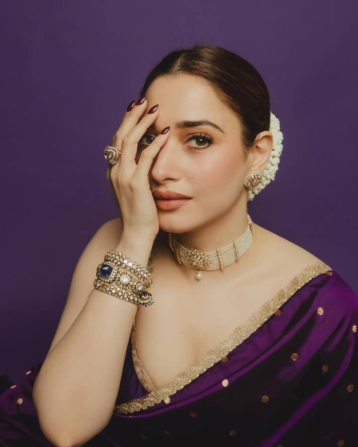 Just like her stunning outfits, Tamannaah Bhatia knows exactly how to elevate a look with the right jewelry—be it layered chains, chunky bracelets, or statement earrings. She pulls them off with ease and elegance. Here are 7 times Tamannaah’s latest jewelry looks proved her unmatched style game!