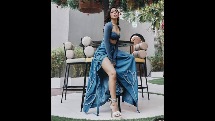 7. Alaya F: Alaya F exuded a bohemian chic in her striking denim-toned monochrome attire. The playful outfit featured a deep blue ruched bralette paired with a matching high-slit denim maxi skirt. The outfit added various textures to the fit which gave the actress's look depth. The hand-embroidered floral appliques near the hem, added an artistic touch. Alaya's ensemble gave her whimsical look with a daring touch. (Image Source: Instagram/@alayaf)