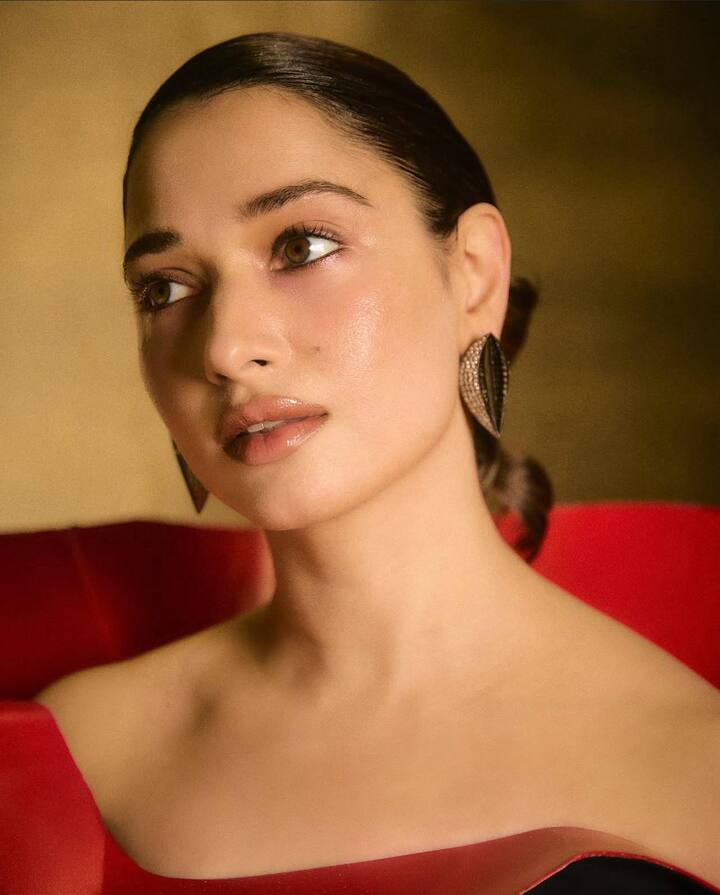 Diamond Dreams: Tamannaah looked like a vision in black and red, but it was her jewellery that stole the show. A pair of dazzling diamond statement earrings added brilliance and elegance, proving how she masterfully uses bold yet minimal pieces to elevate sophistication.