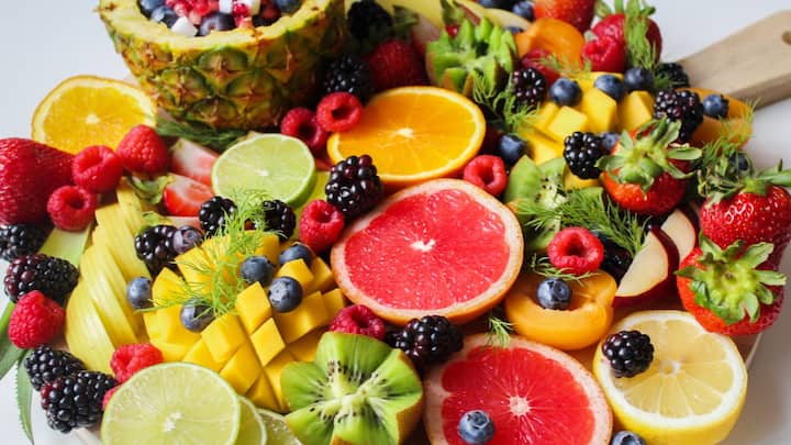 2. Eat Seasonal And Light Foods: Monsoon leads to a slow digestion, so eating heavy or oily food can cause bloating and discomfort. Opt for light and freshly cooked meals that are easy on stomach. Seasonal vegetables like bitter gourd, bottle gourd, and pumpkin support digestion. Fruits like apples, plums, and pears are hydrating and provide antioxidants. Avoid raw leafy greens that might carry germs and include nourishing foods like soups, khichdi, and steamed dishes which maintain energy, support gut health, and keep monsoon-related illnesses at bay. (Image Source: Canva)