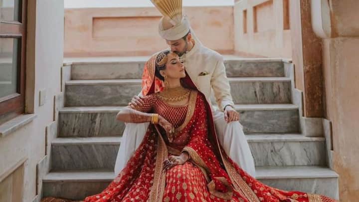 The Kiss (or Close Enough): Not all cultures possess the ceremonial kiss, but the gentle foreheads-touching moment, the nuzzle of the nose, or the bashful look after the ritual—those are cinematic too, and much more intimate. (Image Source: Pinterest/ lehengabynanducheipuri