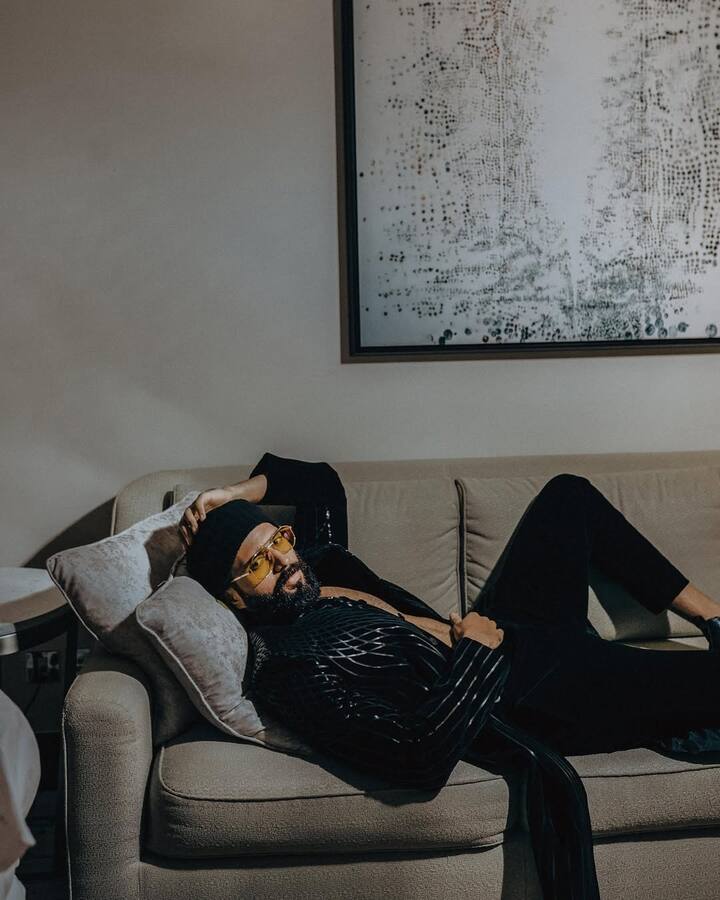 The home’s minimalist design language embraces warmth through textures, light, and organic tones.