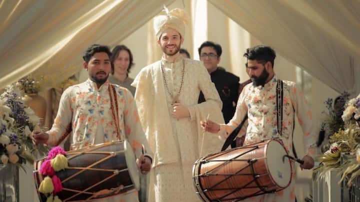 The Groom's Swag Entry: Let's be frank—this one's a crowd-puller. Mounted on horseback, in an antique car, or stomping his way through the baraat, the bridegroom's arrival is worthy of its own rockstar reel. (Image Source: Pinterest/ wedfield_photography