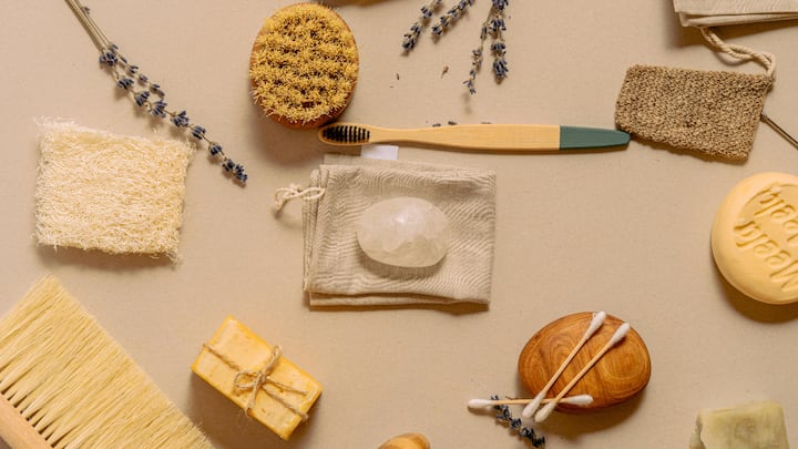 4. Use Sustainable Toiletries: Opt for bamboo toothbrushes, natural soaps, and refillable containers. These plastic-free alternatives are biodegradable and reduce the bathroom waste. This step minimises your environmental impact without compromising on hygiene. (Image Source: Canva)