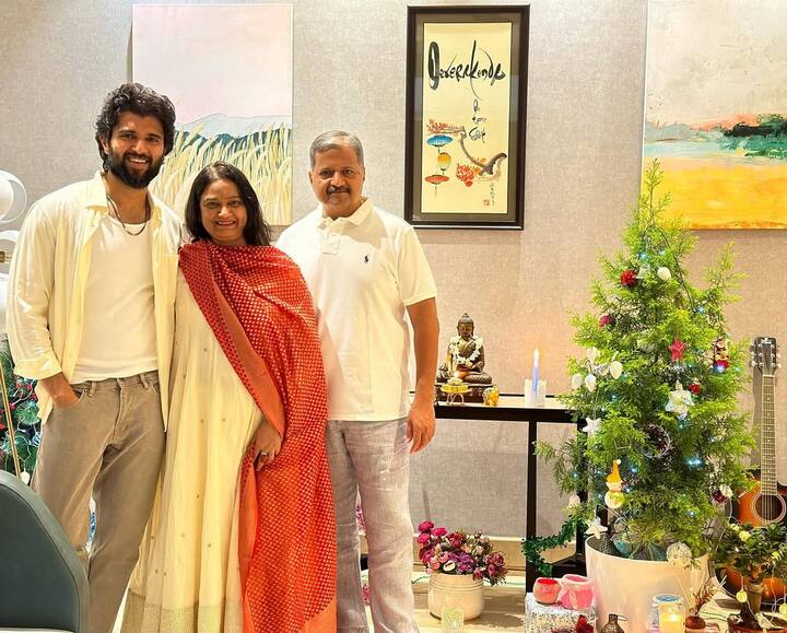 The sun-drenched living room is bathed in natural light, thanks to expansive French windows.