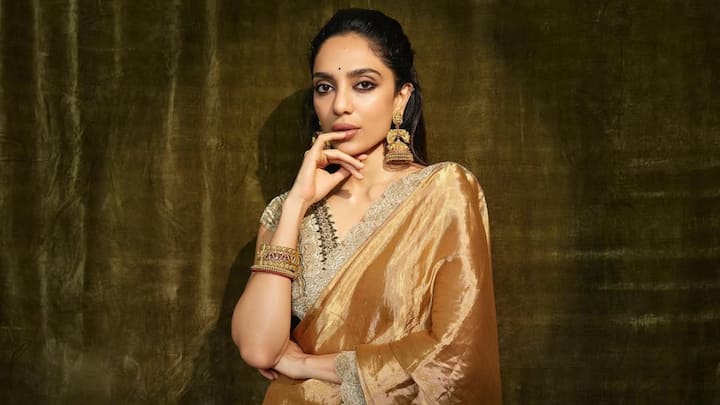 Sobhita dazzled in this golden silk saree; the look, coupled with an embroidered blouse, was the epitome of traditional elegance with a touch of grandeur. (Image Source: Instagram/ sobhitad)