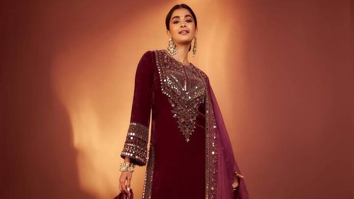 Pooja Hegde exudes ageless beauty in this maroon suit. Her subtle pairing of traditional silhouettes with contemporary cuts and show-stopping jewellery makes her appear absolutely right for festive Bakrid celebrations. (Image Source: Instagram/ hegdepooja)