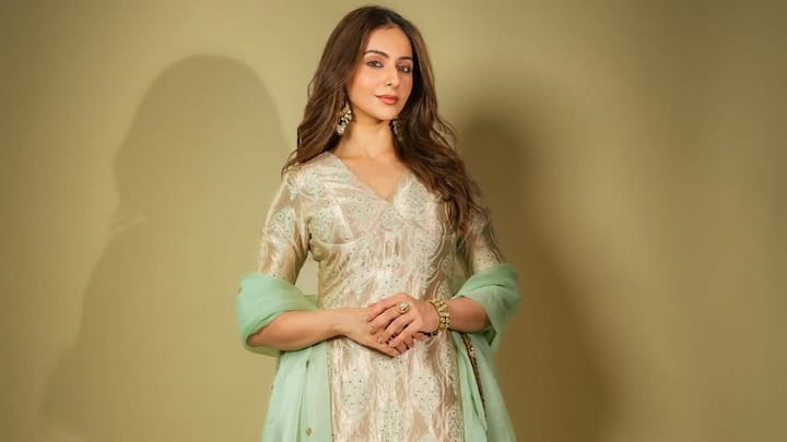 Rakul Preet's beige kurta set with a bright green printed dupatta is a graceful and celebratory look. Understated elegance along with bold accessories makes this outfit perfect for Bakrid celebrations. (Image Source: Instagram/ rakulpreet)