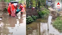 রাস্তা যেন নদী! মহিলাকে নিয়ে গর্তে টোটো উল্টে বড় বিপদ! এলাকায় বিক্ষোভ