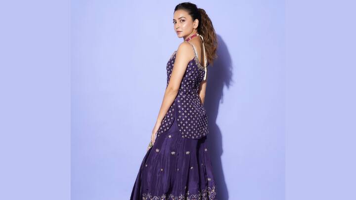 Kriti Kharbanda dons spring freshness in this blue printed silk sharara set. The rich prints and slimming silhouette of this colourful ethnic wear make it perfect for a lively yet elegant Bakrid look. (Image Source: Instagram/ kriti.kharbanda)