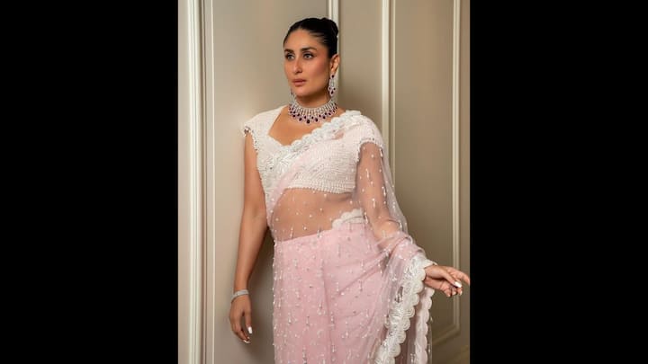 6. Kareena Kapoor: Kareena Kapoor opted for a sheer pastel pink saree that was delicately embellished with pearls and sequins. The scalloped lace border added a soft touch, making it ideal for Eid festivities. The blouse was intricately beaded which added glamour to the fit. The actress accessorised her saree with diamond and ruby statement necklace and earrings, which gave her a royal finish. (Image Source: Twitter/@dasarisubash)