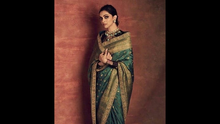 8. Deepika Padukone: Deepika Padukone's regal green and gold saree is a perfect choice for the Eid festivities. The saree was adorned with intricate gold zari work and delicate polka motifs throughout. The wide golden border added depth and a majestic appeal to the traditional fit. The actress paired her saree with a full-sleeved blouse in a darker contrast tone. Perfectly suited for the spirit of Eid, she complemented her look with statement jewellery pieces that gave a timeless and royal aesthetic. (Image Source: Pinterest/keshariruby68)