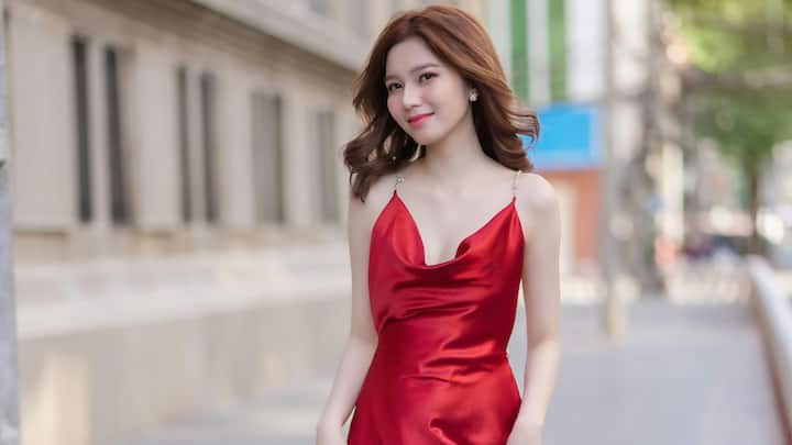 Slip Dresses: Minimal and classy, slip dresses are back. Whether layered or alone, they present a chic, feminine shape that transitions from day to night. (Image Source: Canva)