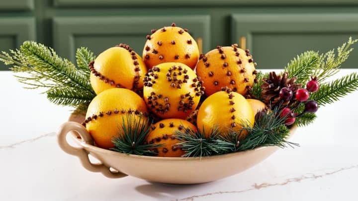 5. Pomander Balls: Make a pomander ball by studding oranges with cloves. These decorative balls release a sweet and spicy aroma that helps keep the room smelling fresh and pleasant. This DIY room freshener also acts as a natural insect repellent. (Image Source: Pinterest/bhg)