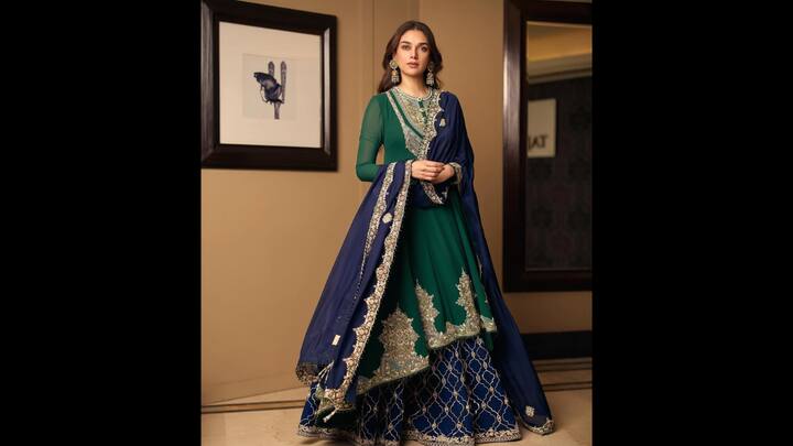5. Aditi Rao Hydari: Aditi Rao Hydari stunned in a regal ensemble and radiated royal elegance. The actress wore a deep emerald green Anarkali that featured sheer sleeves, intricate zari embroidery, and tailored bodice. She paired her green traditional outfit with contrasting blue dupatta and sharara pants. She outfit was lavishly bordered which enhanced the traditional appeal and exuded grace. The ornate embroidery and shimmer made the ethnic outfit perfect for evening Eid gatherings. (Image Source: Instagram/@aditiraohydari)