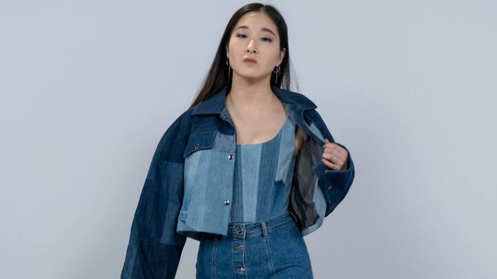 Denim-on-Denim: A denim-on-denim look, once iconic in the early 2000s, has made a sleek return. Mixing different denim shades creates a cool, coordinated outfit that's stylish and effortless. (Image Source: Canva)