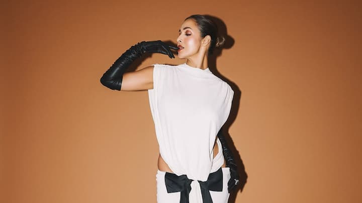 Malaika Arora Turns Up the Glam in Edgy Backless White Gown & Leather Gloves