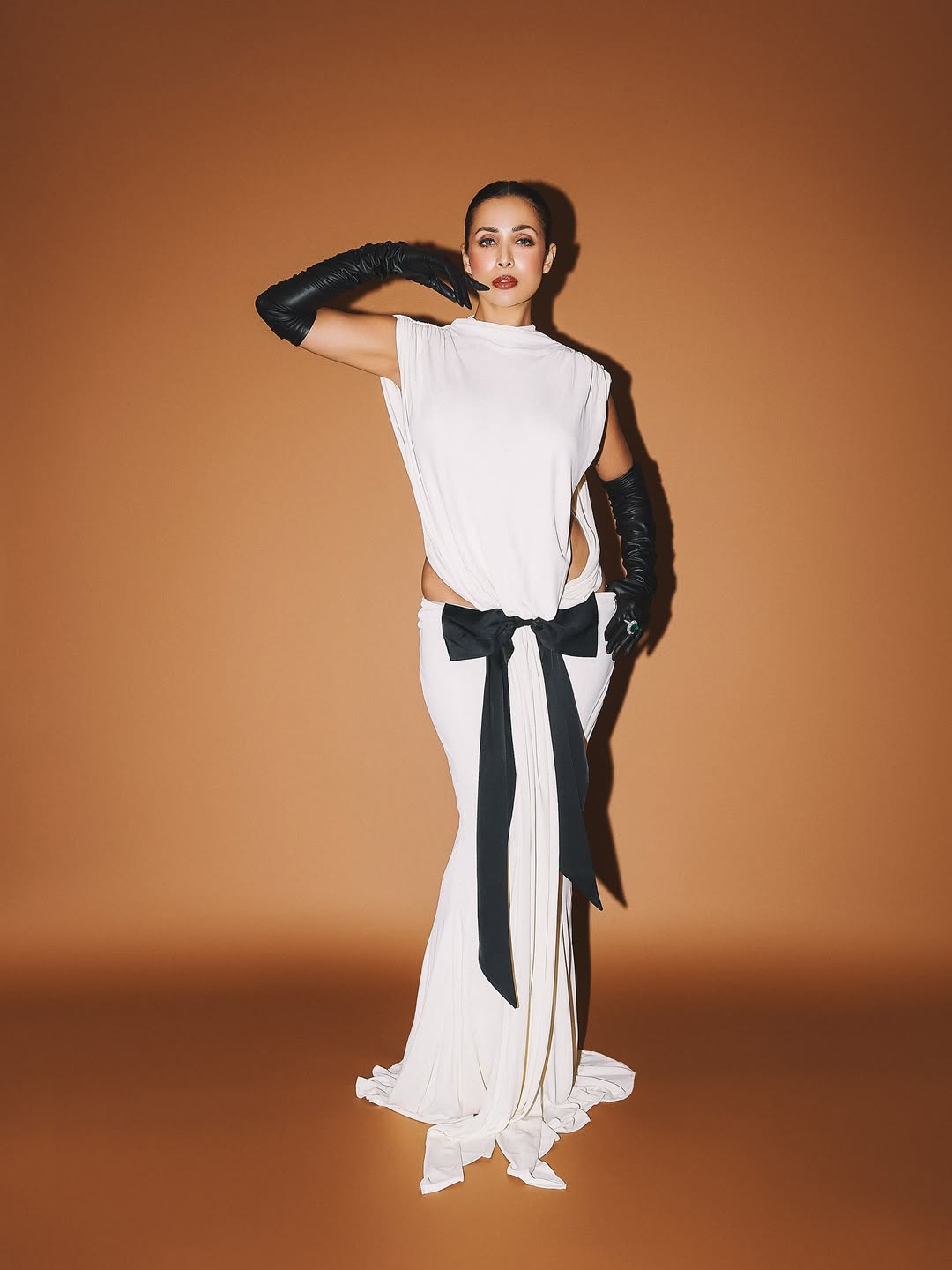 Malaika Arora Turns Up the Glam in Edgy Backless White Gown & Leather Gloves