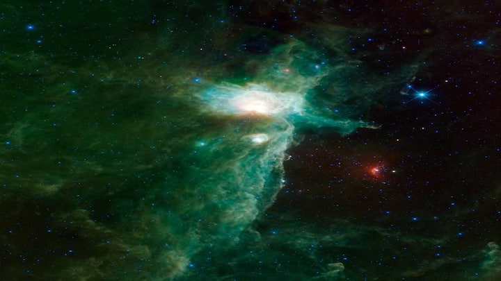 Lying near Orion’s Belt, this glowing cloud is lit by ultraviolet radiation from nearby stars. About 1,400 light-years from Earth, the Flame Nebula is active with star formation and surrounded by dark dust lanes that resemble a fiery blaze.