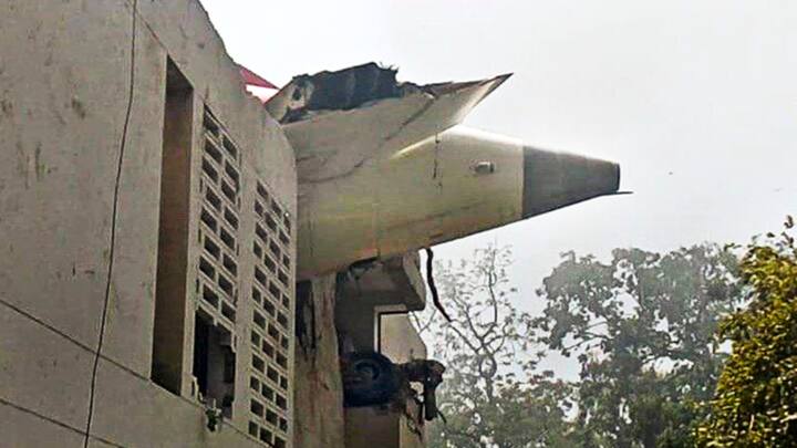 Parts of the fuselage crashed into the back wall of the building, leaving twisted metal and shattered concrete scattered across the site. (Image Source: PTI)