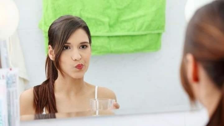 6. Oil Pulling: An ancient Ayurvedic practice, oil pulling requires swishing a tablespoon of coconut or sesame oil in your mouth for 10–15 minutes before brushing your teeth. Traditionally, it was believed to ‘pull’ toxins out of the body through the saliva. Modern studies show that oil pulling reduces harmful bacteria, lowers plaque buildup, and may even help prevent gingivitis. (Image Source: Pinterest/amerikanki)