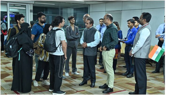 MoS External Affairs Kirti Vardhan Singh greets evacuated students from Iran, underlining India’s active diplomacy in safeguarding its citizens. (Image: PTI)