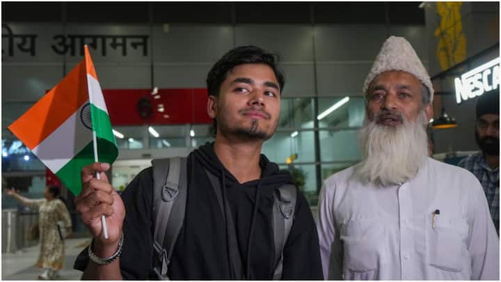 An emotional moment as a young evacuee, fresh from Iran via Armenia, stands with a loved one at Delhi airport, safe at last. (Image: PTI)