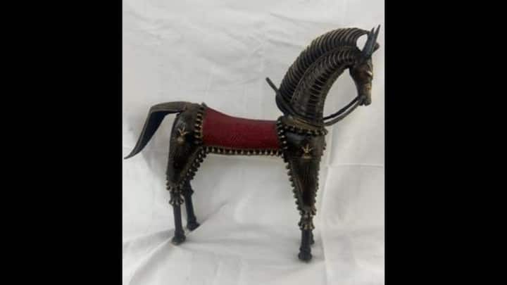 9. Brass Dokra Horse: The South African President, Cyril Ramaphosa, was gifted a Brass Dokra Horse from Chhattisgarh. This handcrafted piece is made using the ancient lost-wax casting technique by tribal artisans. Each Dokra horse is one-of-a-kind, blending traditional and contemporary design elements. In tribal culture, the horse symbolises strength, loyalty, and devotion, and such figures are often offered in rituals. he brass horse is adorned with intricate details like twisted wire patterns, bells, and harnesses. (Image Source: Twitter/@ANI)