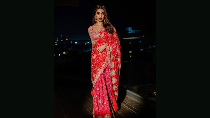 8. Pooja Hedge: Pooja Hegde looked ethereal in her timeless bandhani saree. The highlight of this saree is the detailed gold embroidered border that added a regal touch. Paired with a matching blouse and styled with statement jewellery, Pooja’s look is the perfect example of understated glamour rooted in culture. The stunning saree beautifully blended tradition with modern elegance. (Image Source: Instagram/@faabiianaindia)
