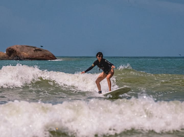 In the pictures, Fatima is seen surfing among the waves wearing a black color monokini.