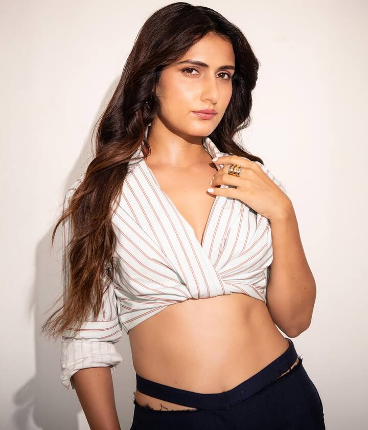 Fatima kept her accessories minimal with just a chunky ring, letting her outfit speak volumes.