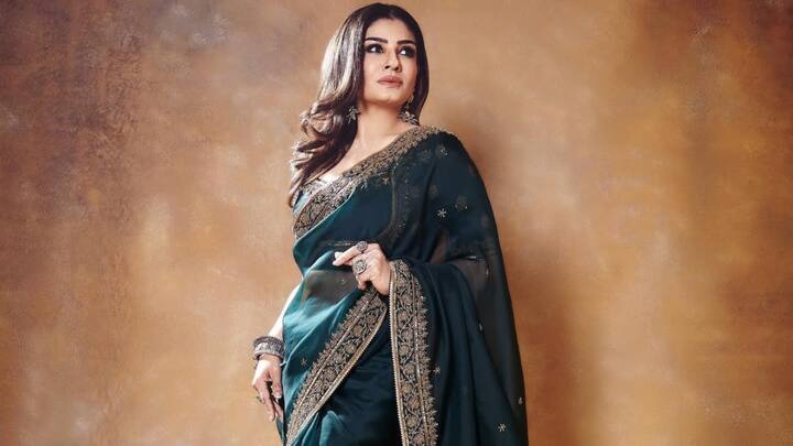 Raveena Tondan oozes in this dark green saree with silver embroidery. She maintained the overall look simple with minimal makeup and jewellery, allowing the saree to be the centre of attention. (Image Source: Instagram/ officialraveenatandon)