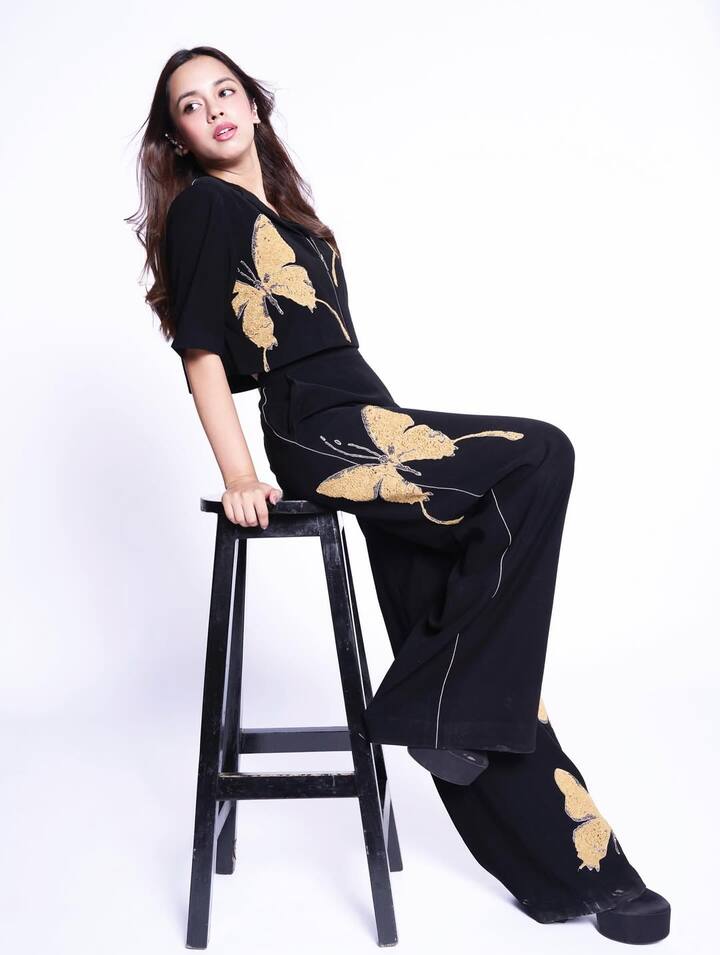 Paired with a high-waisted palazzo pants in the same print, the look balances structure with ease, making it perfect for both festive outings and high-glam events.