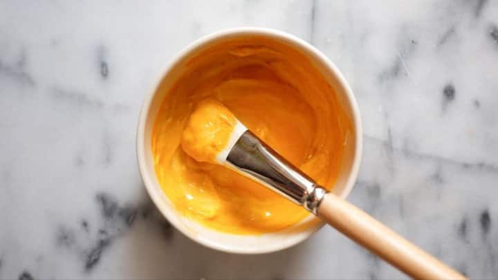 3. Turmeric Face Pack: For a glowing skin, this easy and effective face pack is an ideal choice. Simple mix turmeric with gram flour and curd to create a brightening face pack. Apply and leavy it for about 15 minutes. It will help reduce acne, even out skin tone, and add a natural glow to your face. (Image Source: Pinterest/beautymirrorrr)