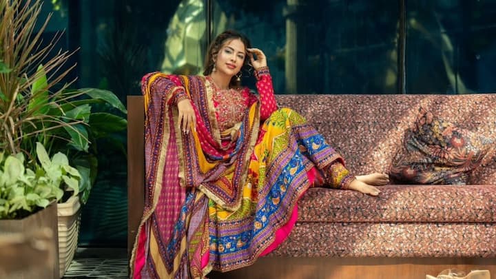 Attiring herself in this vibrant tradition, a multicoloured Anarkali, the suit enriched with Gota Patti detailing. The mischievous colour and delicate embellishments provide a bold yet elegant look. (Image Source: Instagram/ avikagor)