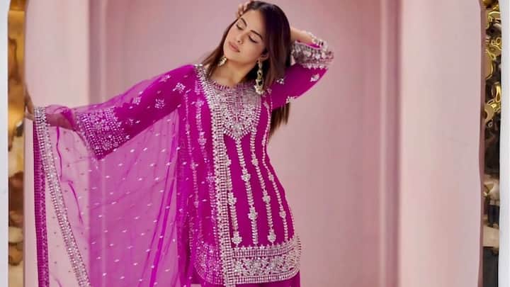 Avika shines in this magenta sharara set featuring mirror and sequin work. The well-defined styling and smooth, sleek hairdo make it a beautiful option for celebration festivals. (Image Source: Instagram/ avikagor)