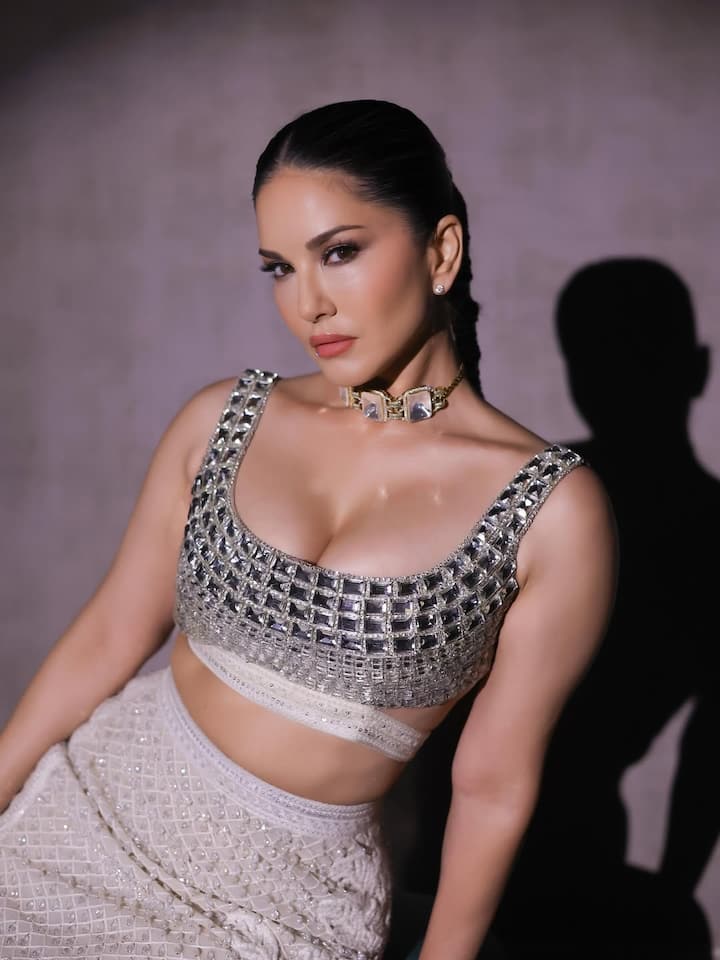 She is wreaking havoc in deepne and sleeveless blouses rooted with silver stones.