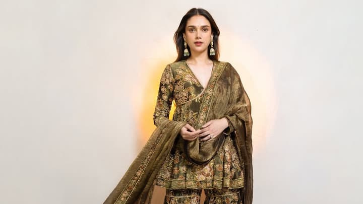 Aditi shone in this green peplum blouse and sharara with sequin embroidery. The floral print and glittering accents gave a regal yet modern touch to the attire. (Image Source: Instagram/ aditiraohydari)