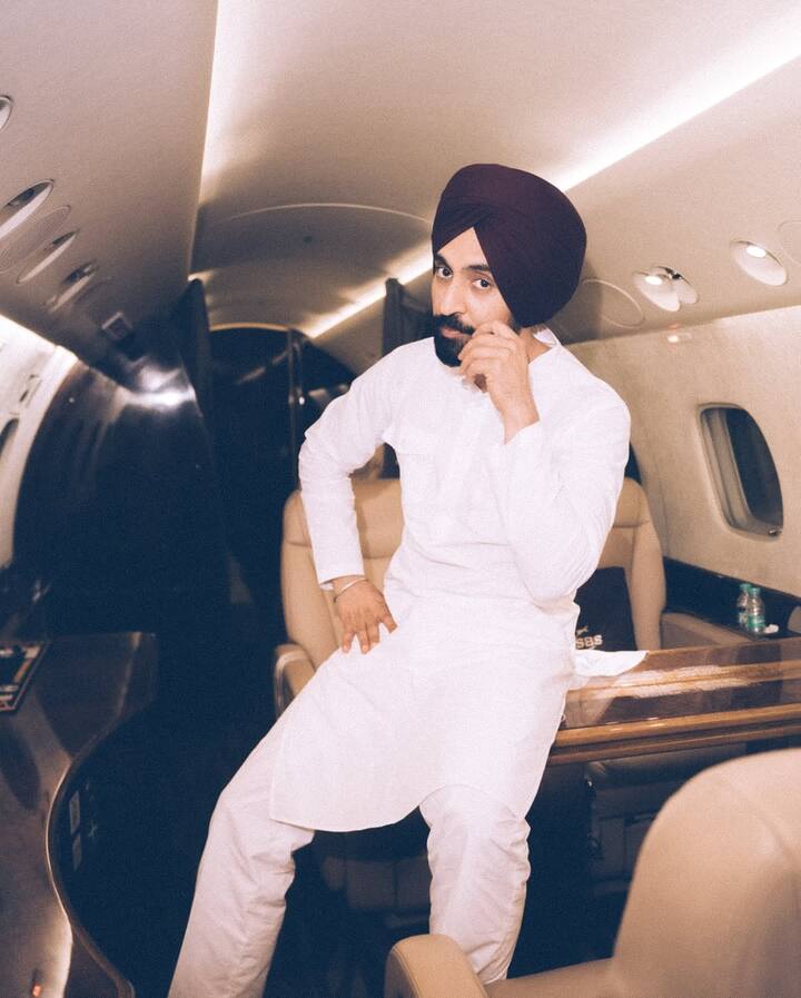 Diljit shared Instagram photos of himself in a private jet, dressed in white kurta-pyjama.