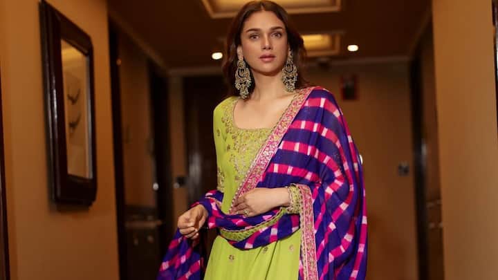 Aditi looked regal in this parrot green and pink Patiala suit. The bright colours and time-honoured silhouette made it a happy and cheerful traditional outfit. (Image Source: Instagram/ aditiraohydari)