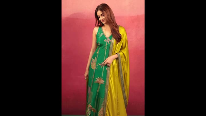 1. Keerthy Suresh: Keerthy Suresh stunned in a vibrant green anarkali suit, making it an ideal choice for Harilayi Teej celebrations. The sleeveless silhouette adorned with delicate embroidery added a festive charm, while the contrasting yellow silk dupatta gave the actress a striking look. Keerthy Suresh's outfit is ideal for the joyous spirit of Teej and monsoon's lush hues. The outfit effortlessly blended elegance with tradition. Whether you're performing rituals or attending a Teej gathering, Keerthy’s ensemble sets the tone for grace and celebration. (Image Source: Pinterest/ramansukla98)