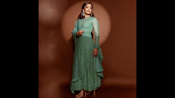 7. Rashmika Mandanna: Rashmika Mandanna radiated a regal charm in her mint green embroidered anarkali. This outfit served as a dreamy pick for the celebrations of Hariyali Teej. The intricate threadwork paired with sheer full sleeves added a mix of tradition and trend. The layered hemline added a graceful flow, which made it traditional fit ideal for swing rituals and festive gatherings. The actress completed her look with a matching dupatta draped effortlessly over the shoulder and statement green earrings that elevate the overall appeal. (Image Source: Pinterest/actressblaze)