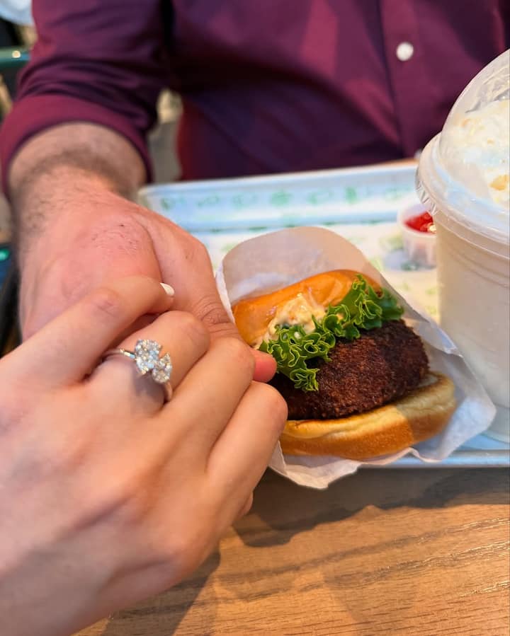 The engagement took place in front of a historic castle, making the moment picture-perfect and emotional.