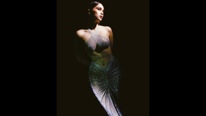 7. Sharvari Wagh: Sharvari Wagh stole the spotlight in this dazzling metallic co-ord. Draped in a shimmering silver ensemble, the outfit featured a crisscross halter top with bold cutouts and a figure-hugging ruched skirt that flowed like liquid light. Sharvari’s minimal glam, glowing skin, nude lips, and sleek pulled-back hair, gave the spotlight to the outfit. With mirror-finish detailing and glittery texture, this look blended high fashion with a futuristic edge. (Image Source: Instagram/@sharvari)