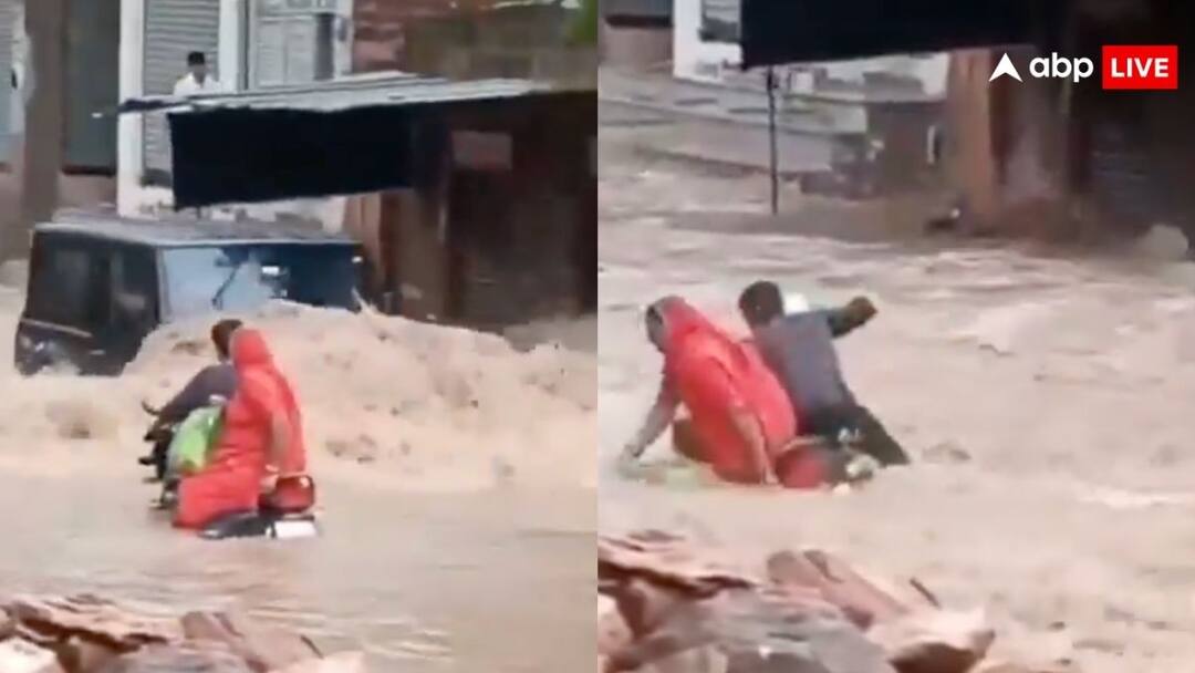 rajasthan thar driver intentionally pushed bike rider he fell on the road filled with water netizens furious video goes viral on social media बारिश में थार वाले ने बाइक सवार को गड्ढे में गिरा दिया, वीडियो देख आपका भी खून खौल उठेगा