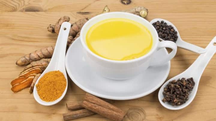 4. Turmeric And Black Pepper Milk: A cold or mild viral responds well to turmeric milk. Add a pinch of black pepper to enhance absorption. Drink this warm during bedtime. It will reduce inflammation, support immunity, and bring down the temperature naturally. (Image Source: Pinterest/drweil)